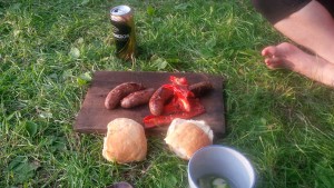 Picture of sausages and bread on wood plate